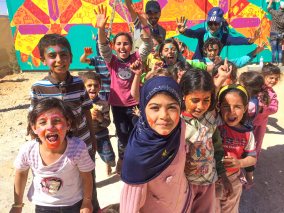 Za'atari Syrian Refugee Camp, Jordan, 2017: Children participating in one of Joel's mural projects
