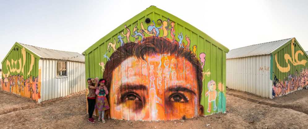 Za'atari Syrian Refugee Camp, Jordan 2017: "A La Rasi!" This mural is inspired by the Arabic phrase meaning "I put you on my head," said to show respect and admiration for someone.