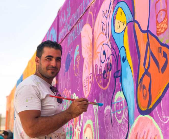 Emad Alkafri, a local artist in Za'atari