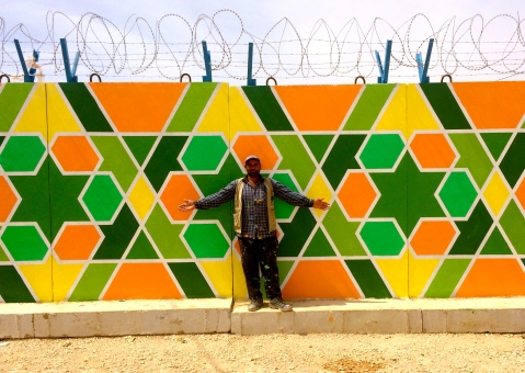 Za'atari Refugee Camp, Jordan 2014: Soft-spoken Syrian artist Ali Kiwan has been beautifying the Za'atari refugee camp where he resides with classic arabesque patterns with a street art influence. Project with aptART, Mercy Corps, ACTED and UNICEF
