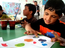 Color- mixing workshop with kids in Za'atari Syrian Refugee Camp.