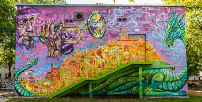 Krakow, Poland 2016: Joel worked with teenagers in foster care to design and paint this community mural that explores local culture and envisions the community and families that the youth envision for their future.